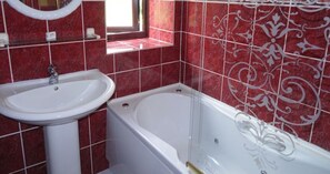 Combined shower/tub, hair dryer, towels, soap