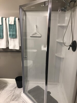 Shower, hair dryer, towels, soap