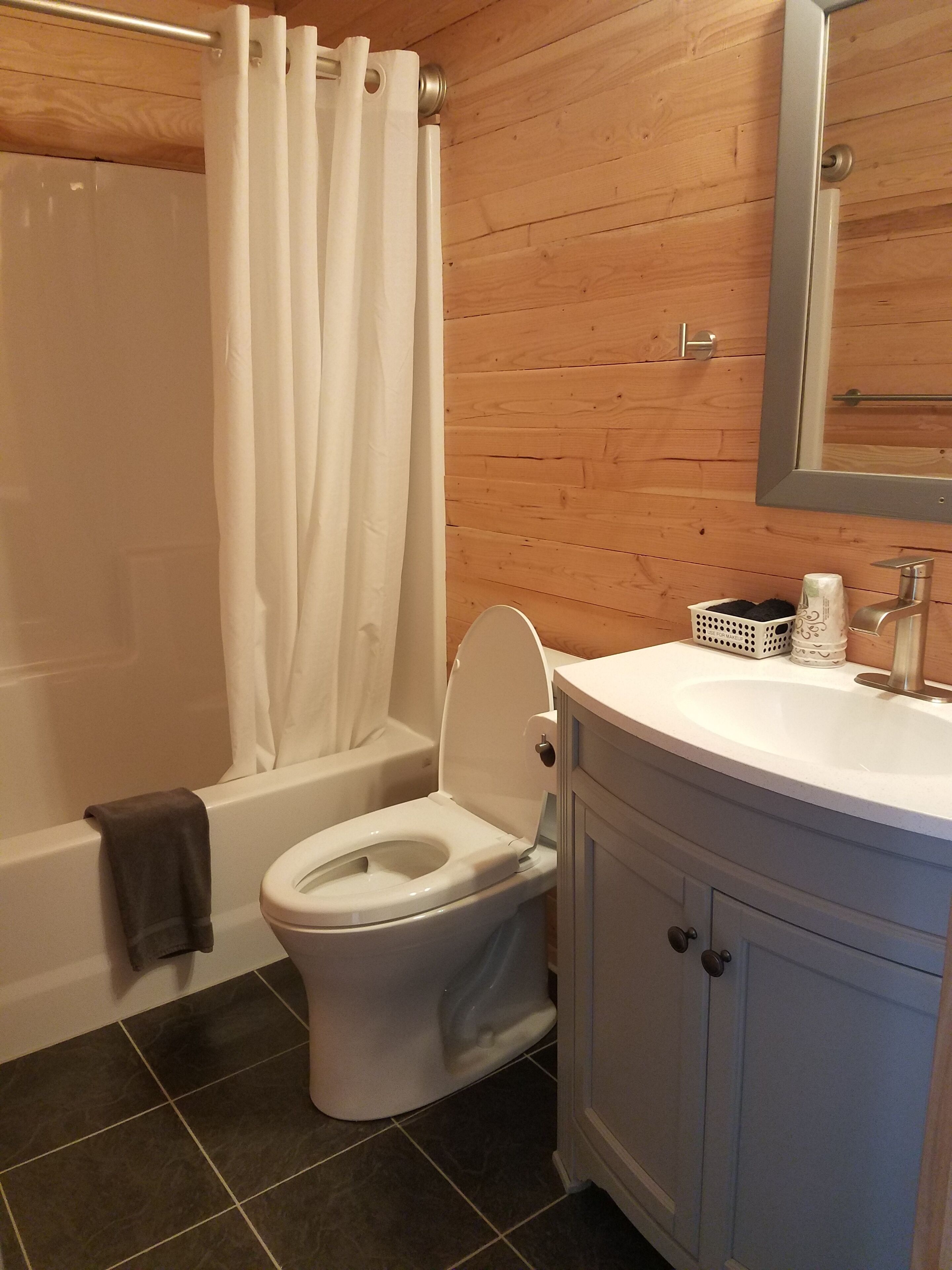 combined shower/bathtub, deep-soaking bathtub, designer toiletries