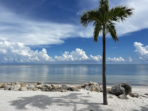 Coastal Charm: 2BR Condo, Patio, Pool Views, Beach