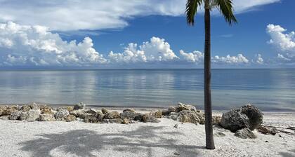 Coastal Charm: 2BR Condo, Patio, Pool Views, Beach