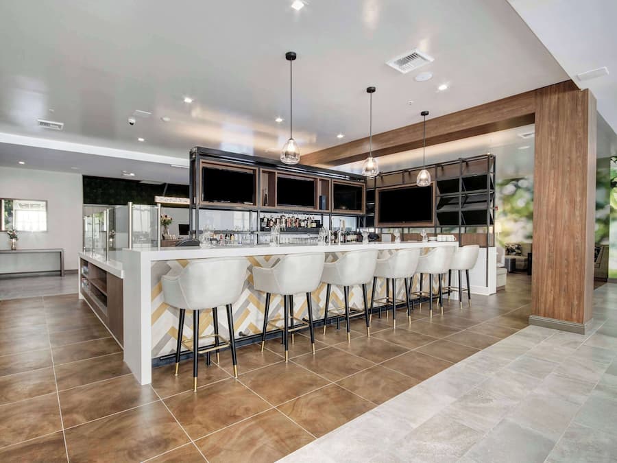 Outdoor pool, open 6:00 AM to 10:00 PM, pool loungers