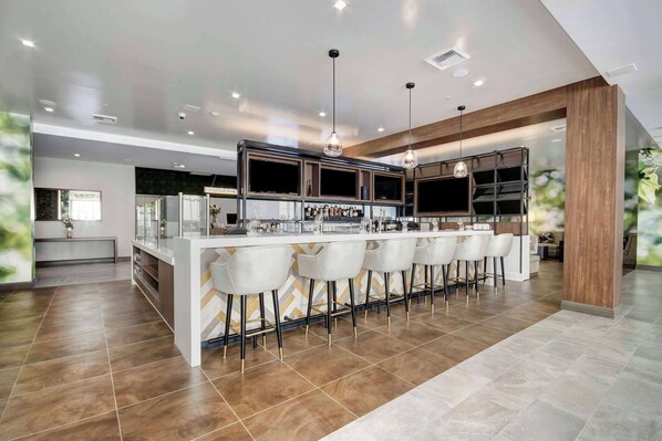 Outdoor pool, open 6:00 AM to 10:00 PM, pool loungers