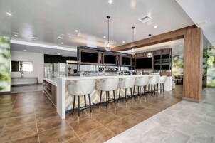 Outdoor pool, open 6:00 AM to 10:00 PM, sun loungers