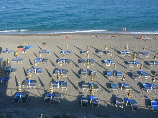 On the beach, sun-loungers