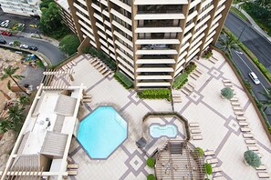 Enjoy the rooftop pool surrounded by lounge chairs and a hot tub.