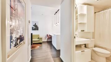 Bathtub, hair dryer, towels, soap