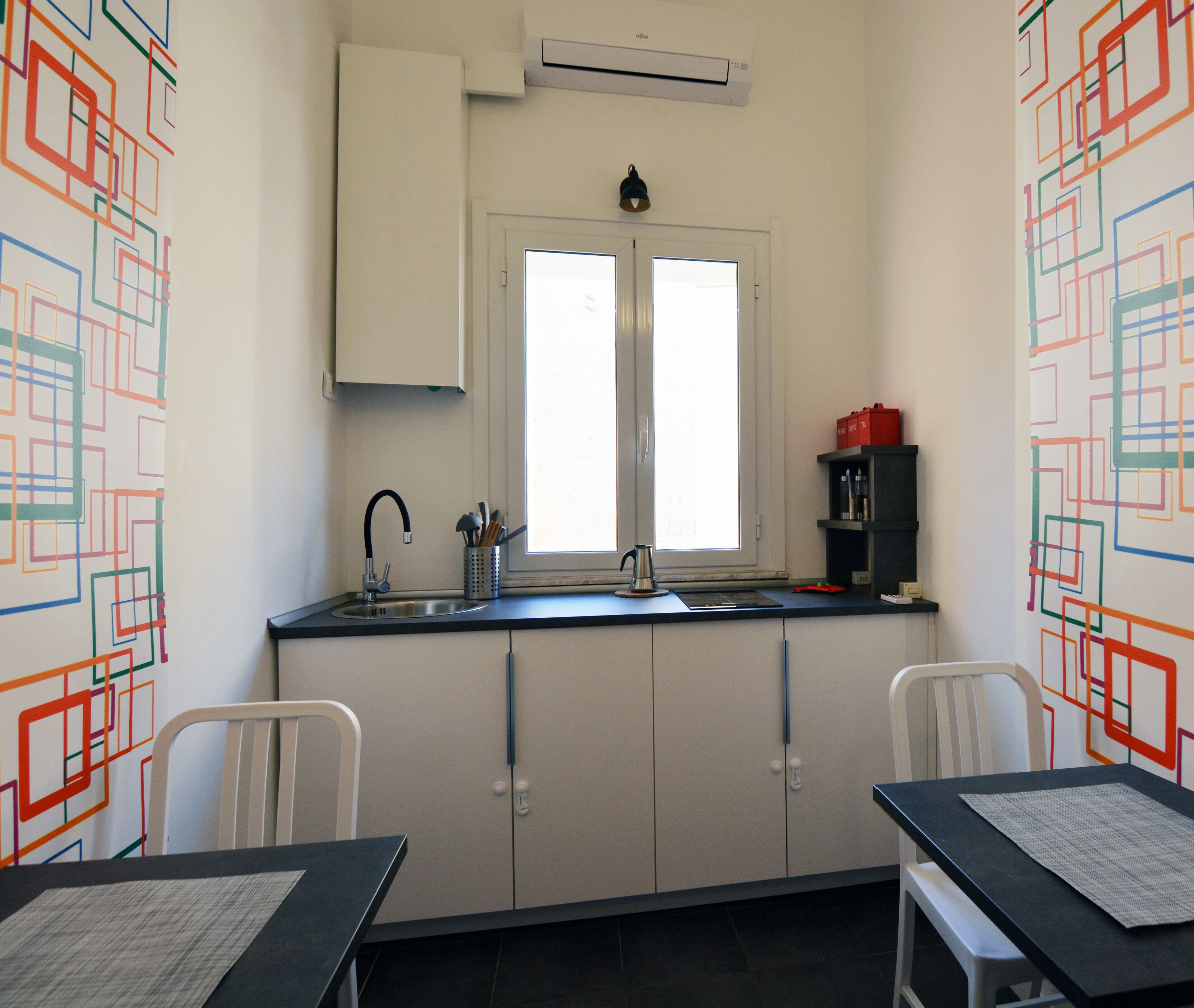 Coffee/tea maker, fridge, stovetop, toaster
