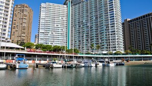 A marina with boats docked, surrounded by high-rise buildings. - Cozy 14th floor condo overlooking the surrounding Waikiki area!  Great price! (Honolulu)