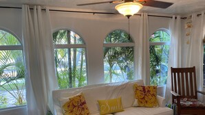 TV, fireplace, books - Old Northwood Heated Pool Home perfect for  virtual family, business, vacation.  (West Palm Beach)