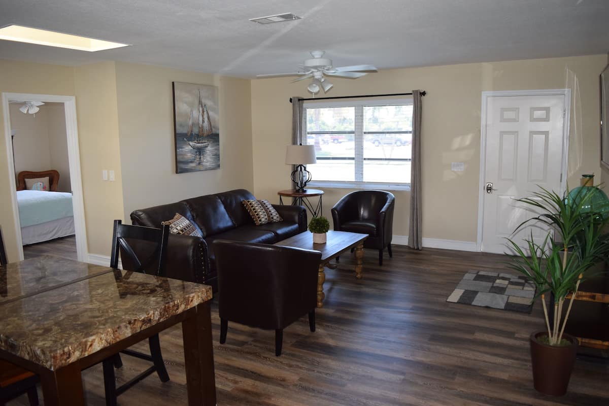 Comfort House | Living area | 50-inch flat-screen TV with premium channels, TV