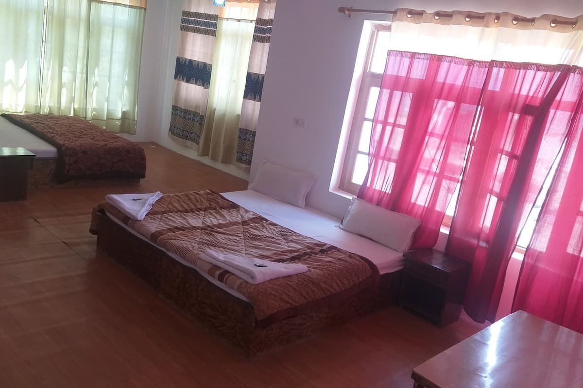 Deluxe Triple Room, 2 Double Beds | Blackout drapes, cribs/infant beds, free WiFi, bed sheets