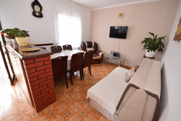 Comfort Apartment, Sea View | Living area | Flat-screen TV