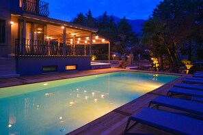 Seasonal outdoor pool, open 9:00 AM to 8:30 PM, pool umbrellas