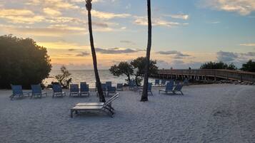 On the beach, sun-loungers, beach towels