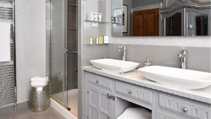 A modern bathroom with two sinks, a glass shower enclosure, and a vanity with storage cabinets. - Stunning Grade II listed Holiday Home in St Leonards On-Sea (Saint Leonards-on-sea)
