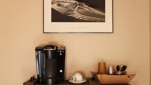 A wooden cabinet with a coffee maker and a framed picture above it. - Boutique Luxury in Upscale Area with Private Entry & Bath, Villa A (SAN DIEGO)