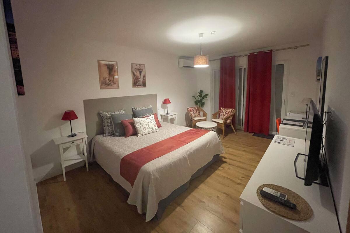 Premium bedding, desk, laptop workspace, blackout drapes
