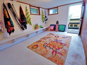 Cozy room with a colorful rug and a window with a view.
