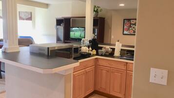 Fridge, microwave, stovetop, coffee/tea maker