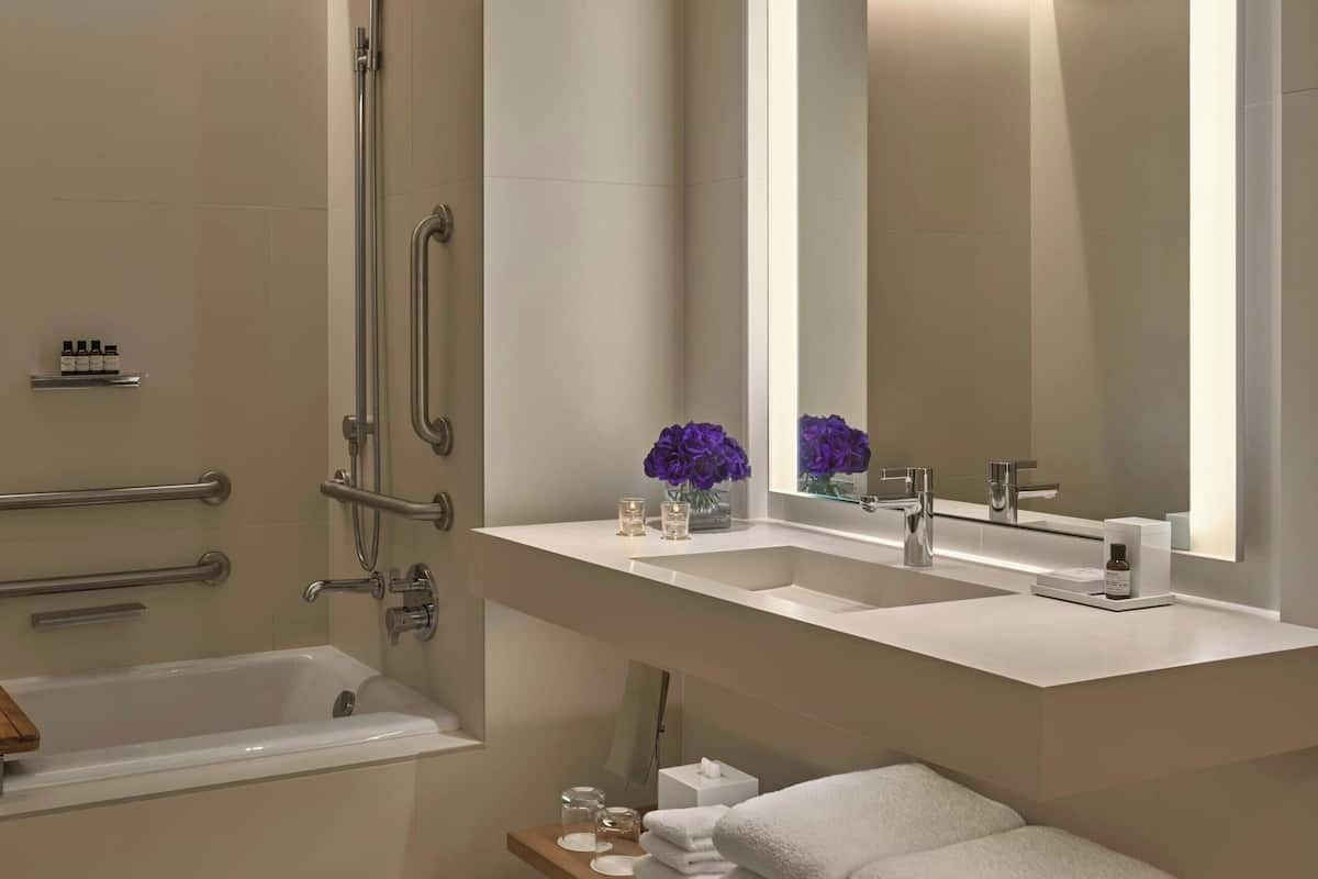 Designer toiletries, hair dryer, bathrobes, slippers