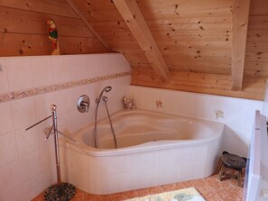 Bathtub, hair dryer, towels, soap