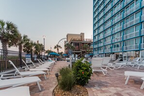 Relax by the pool with a view of the surrounding architecture.