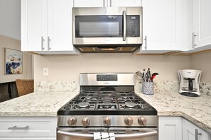 Dishwasher, toaster, highchair, dining tables