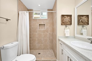 A bathroom with a toilet, shower, and sink. - 3 Bedroom 3 Bath Home w/ Patio 1 block from beach (Newport Beach)