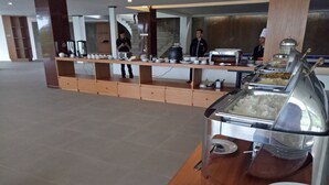 A buffet setup with various food items and a buffet station. - Pondokan Tjiburial (Bandung)