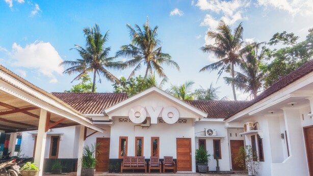 A building with a sign reading "OYO" in front.