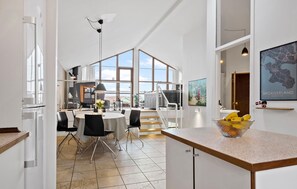 A spacious kitchen with a large island, modern appliances, and a view to the living area. - 3 bedroom nice home in Egernsund (Egernsund)