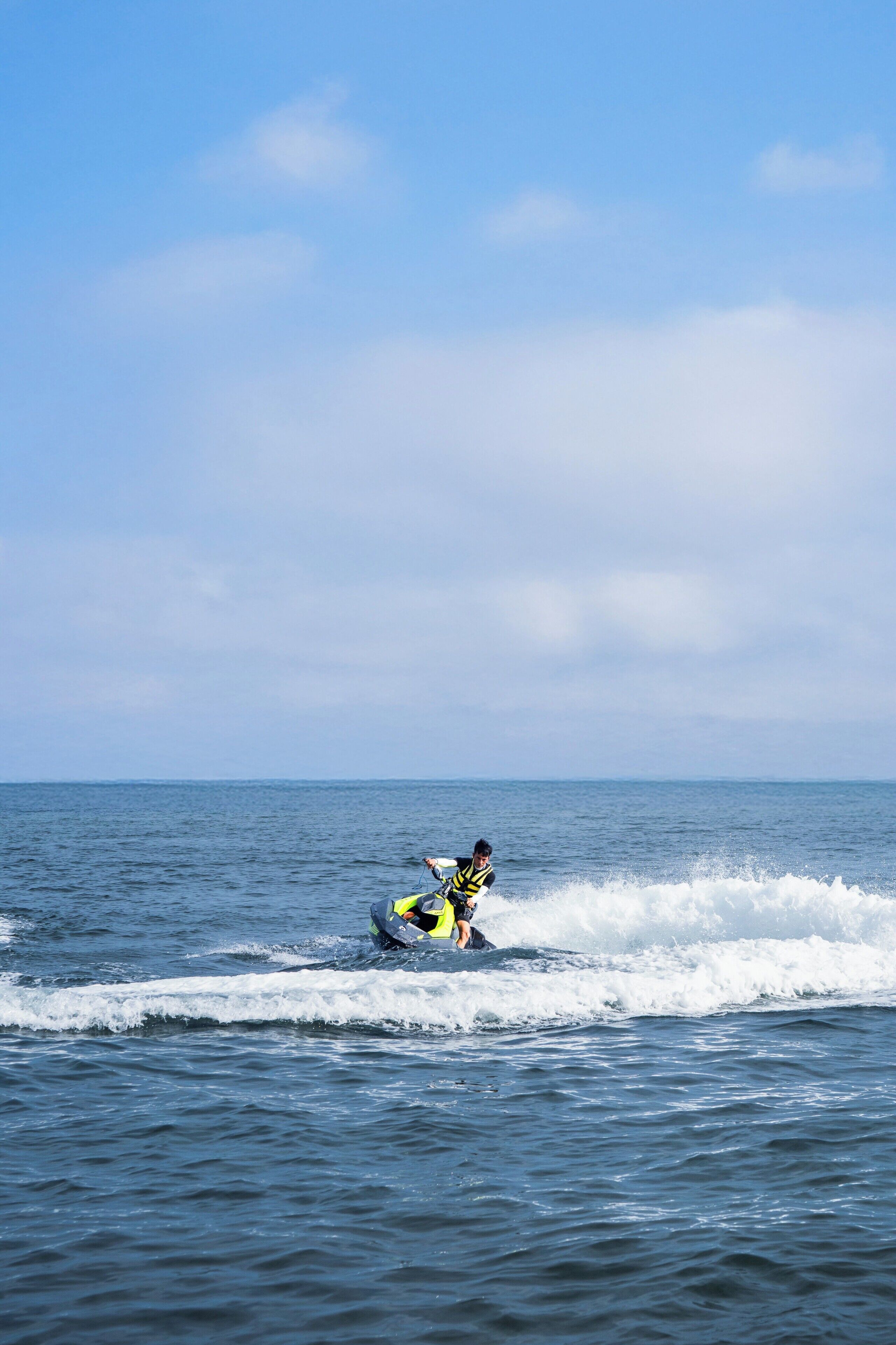 A person on a jet ski in the ocean.