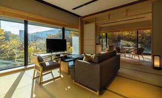 Deluxe Corner Suite | Free minibar, in-room safe, blackout drapes, iron/ironing board