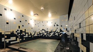A swimming pool with tiled walls and a checkered floor, surrounded by a metal railing. - Green Rich Hotel Tottori Ekimae Artificial Hot Spring Futamata Yunohana (Tottori)