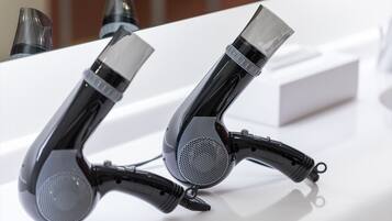 Two black and gray headphones on a white surface.