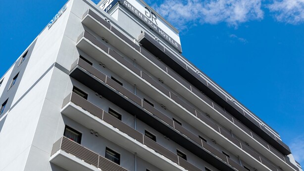 A modern hotel building with multiple balconies and a clear sky. - Green Rich Hotel Tottori Ekimae Artificial Hot Spring Futamata Yunohana (Tottori)