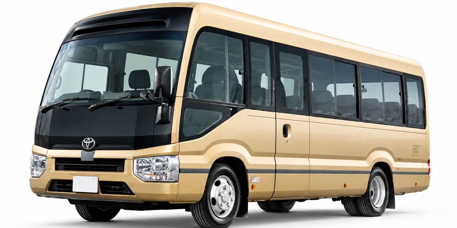 A large, cream-colored bus with a black front section, featuring a prominent front grille and headlights.