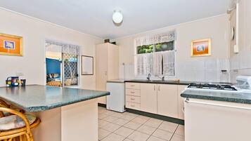 House, 4 Bedrooms | Private kitchen | Full-size fridge, oven, stovetop, cookware/dishes/utensils