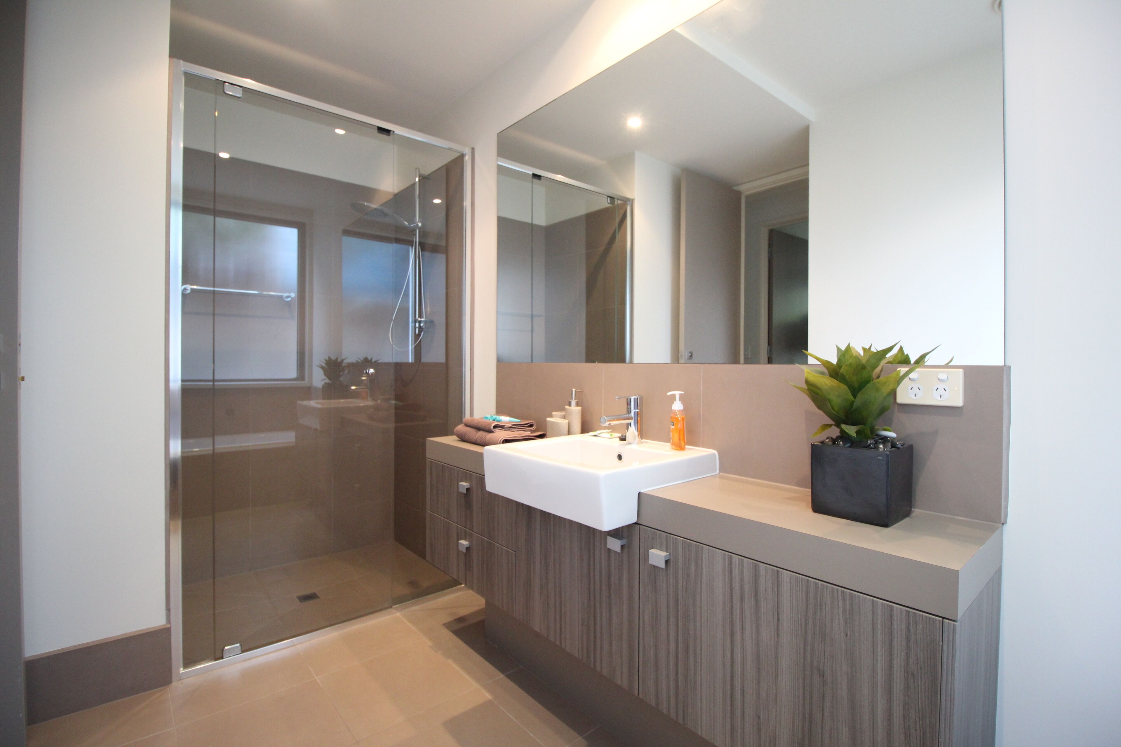 Separate bathtub and shower, towels
