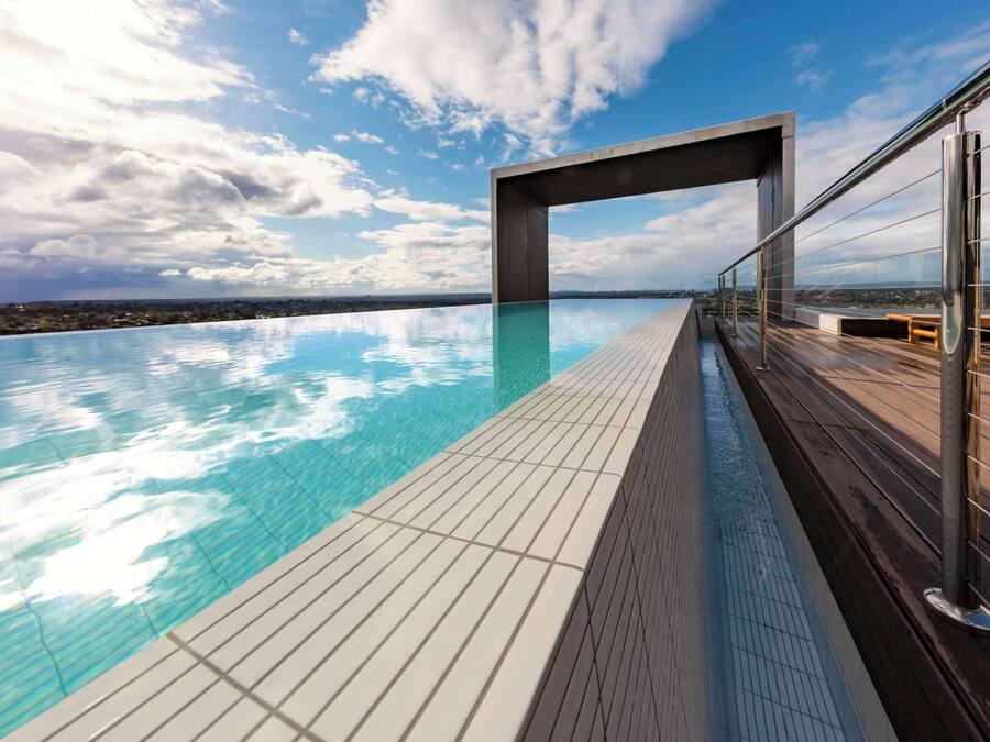 Outdoor pool, open 7:00 AM to 9:00 PM, pool loungers