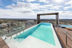 Outdoor pool, open 7:00 AM to 9:00 PM, pool loungers