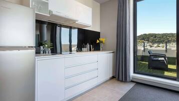 Fridge, coffee/tea maker, electric kettle, cookware/dishes/utensils