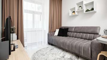 Junior Apartment | Ruang tamu | TV skrin rata