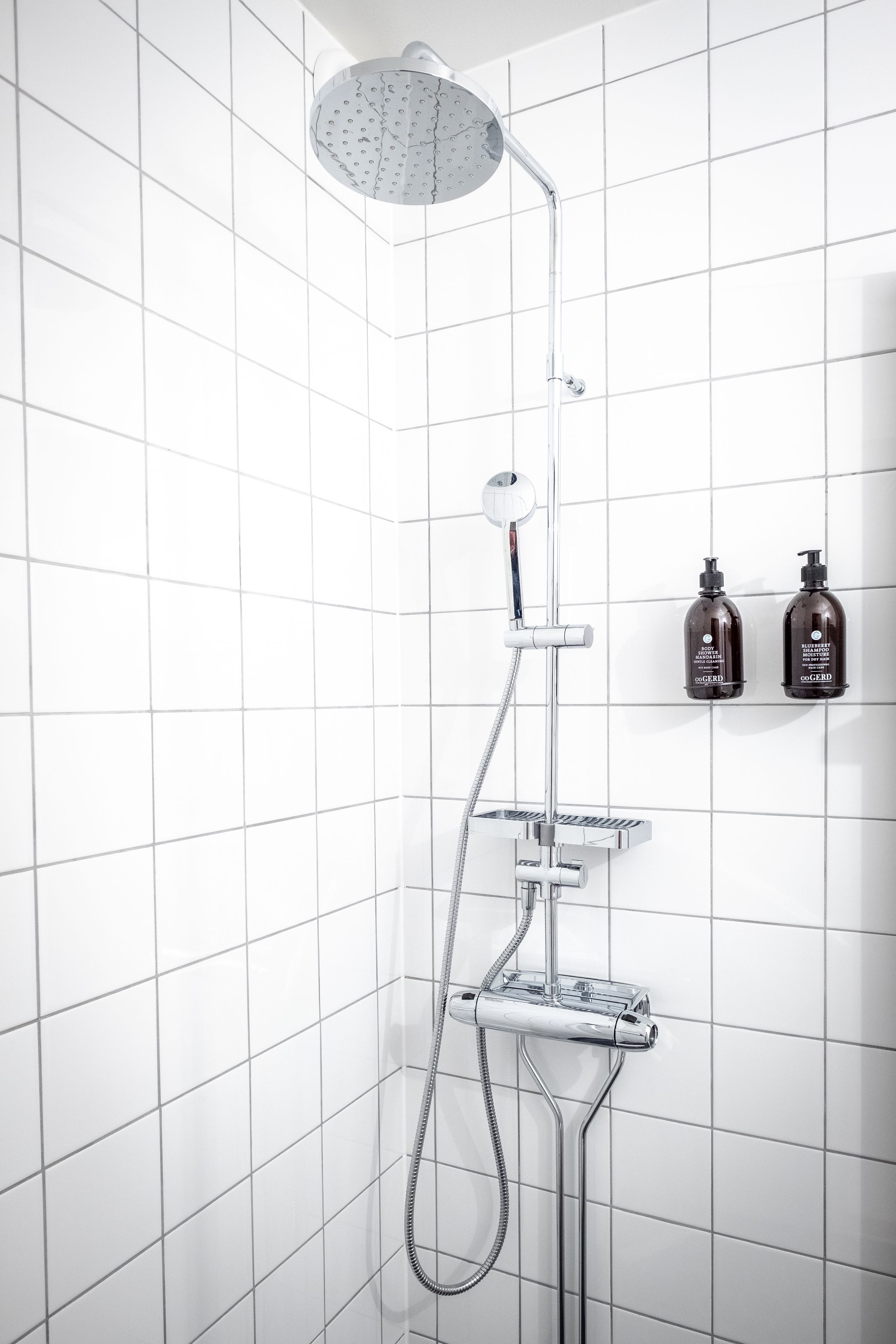 shower, designer toiletries, hair dryer, towels