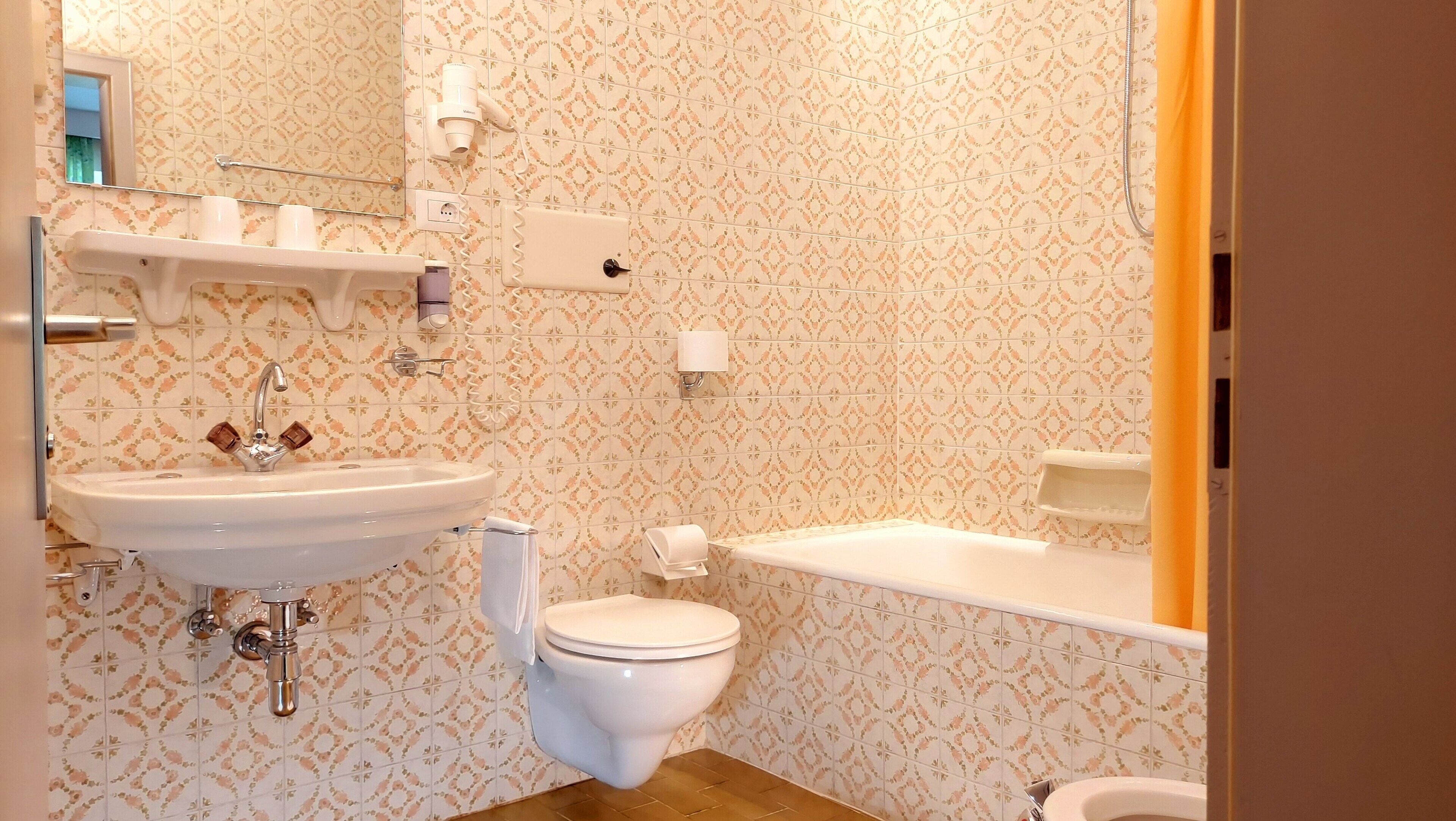 double room | bathroom | hair dryer, towels, soap, toilet paper