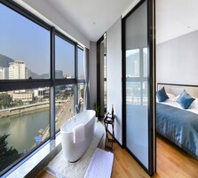 Deluxe Double Room | Desk, blackout curtains, cots/infant beds, rollaway beds