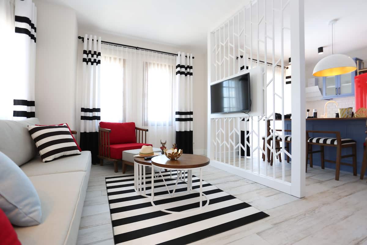 Premium Apartment, Sea View | Living area | 40-inch LED TV with satellite channels, TV
