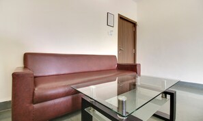 Classic Room, City View | Living area | 32-inch LED TV with cable channels, TV - Hotel Hospice (Surat)