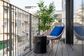 Relax on the balcony with a wicker chair and enjoy the view of the city.